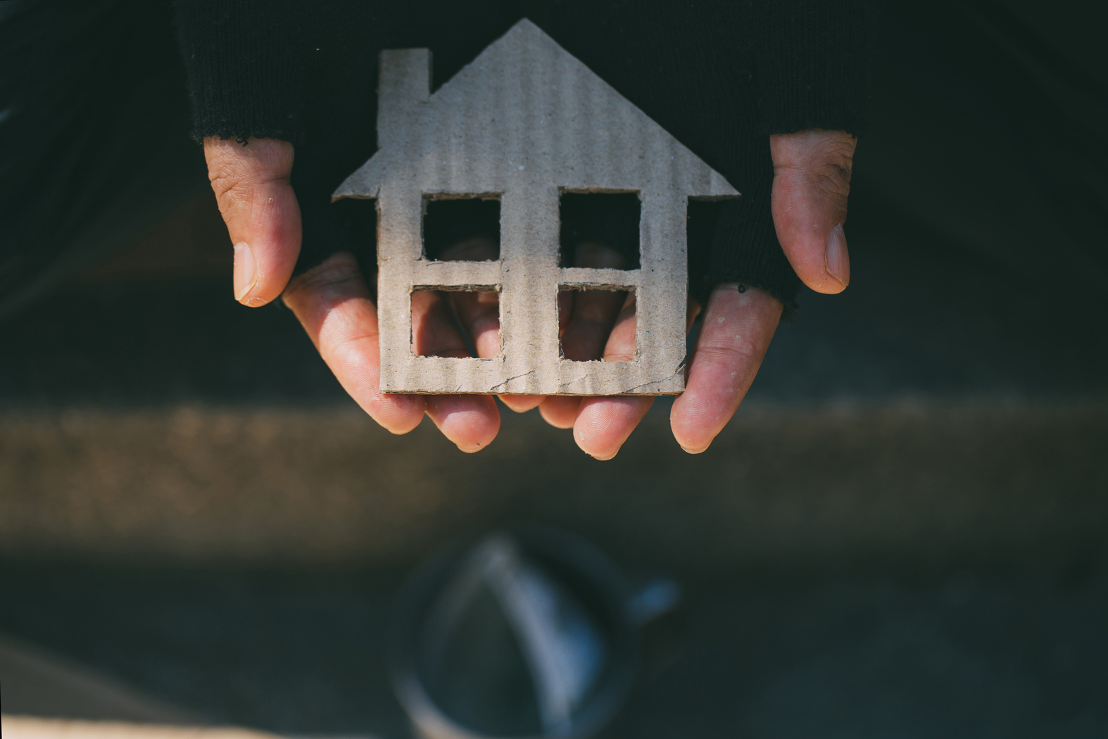 Homeless Man Holding Cardboard House